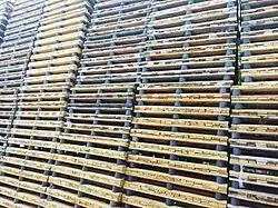 Several large stacks of pallets