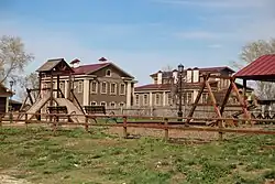 a colour photograph of a brown multi-storey building
