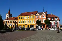 Old German-era houses at the main square with St. George church in the background