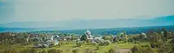 Skyline of the village with its historic wooden church