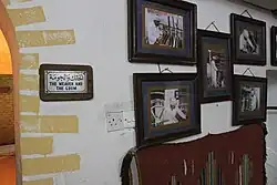 Pictures on a wall featuring a weaver