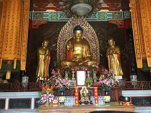 Temple with Buddha image, flanked by Ānanda and Mahākassapa