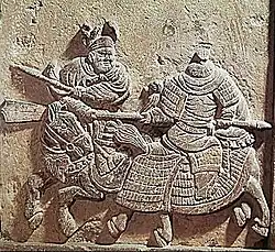 Relief of a Jin rider facing off against a Song cavalryman