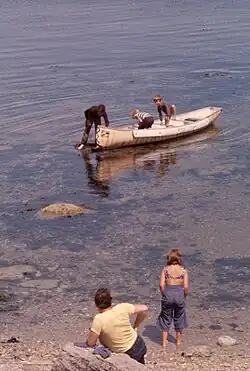 Children playing in the water, bay in an island