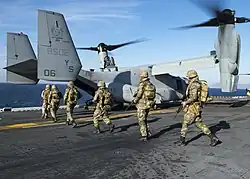 Turkish Marines board an MV-22 Osprey on the flight deck of the USS&nbsp;Kearsarge while participating in Turkish-led and hosted amphibious exercise Exercise Egemen