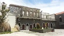 A picture showing the damage to exterior of St. Mary Church of the Holy Belt during the Syrian Civil War.
