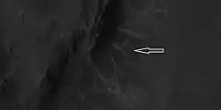 Close view of ridges from previous HiRISE image Arrow indicates an X-shaped ridge.