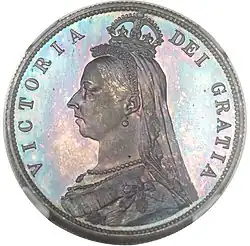 Silver coin with a woman's head on it