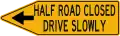 Half road closed, drive slowly