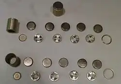 Three battery packs for the 1PN58, two of which are disassembled