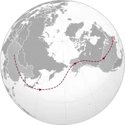 A map of the world, showing a snaking line from the middle of China, across the Pacific Ocean, through Alaska and Canada, and into the northwestern United States