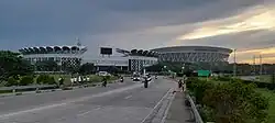 The Philippine Arena and the Philippine Sports Stadium of Ciudad de Victoria seen from the bypass road from Barangay Biñang 1st, Bocaue.