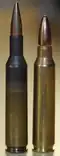 XL1E1 cartridge on the left and a .223 Remington cartridge on the right