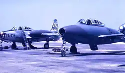 Republic F-84G-2-RE Thunderjet 51-9674 of the 492nd FBS, alongside a 492nd FBS F-84G in an experimental camouflage motif, 1954.