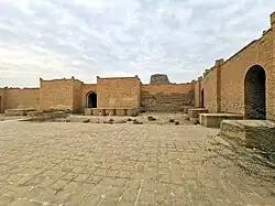 The courtyard of Enlil temple (E-U-GAL), the ziggurat is seen in the background