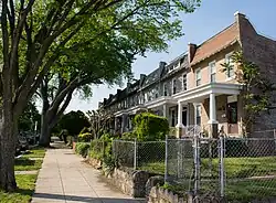 Rowhouses set back uniformly from the street
