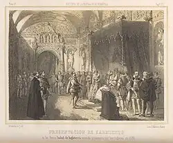 A man stands before Queen Elizabeth, who sits on a throne surrounded by courtiers