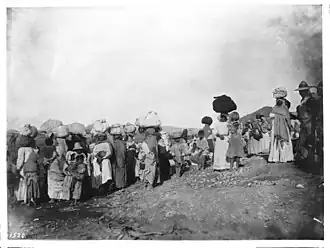 A group of more than 30 Yaqui Indian prisoners being escorted away by Mexican soldiers, Mexico, c. 1910