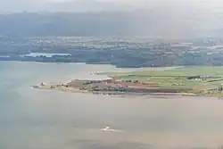 Aerial view of northern Karaka, with Papakura and the Hunua Ranges in the background.