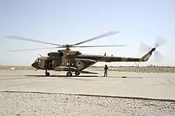 An Afghan Air Force Mi-17 helicopter sits on the ramp at Shindand Air Base in 2011.