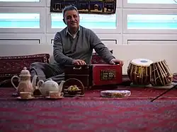Image 5Elements of Afghan culture including: tabla and harmonium musical instruments, an Afghan carpet, teapot, and sheer pira dessert (from Culture of Afghanistan)