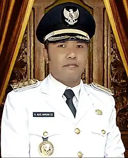 Agus Hamdani in a white uniform