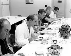 Several men at a sit-down breakfast