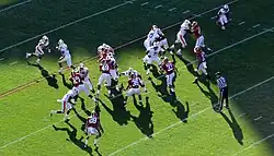 American football players during a play