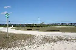 Last remaining section of Ali Baba Circle at intersection with Aladdin Boulevard, showing upper northwest quadrant of what was to be Ali Baba Park.