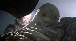 A man looking at the skeleton of an Engineer