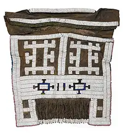 A beaded apron or meputo; late 19th-early 20th century; hide, glass beads, metal beads, straw; 46.9&nbsp;cm ×&nbsp;50.8&nbsp;cm (18.5&nbsp;in ×&nbsp;20.0&nbsp;in); Birmingham Museum of Art (Alabama, USA)