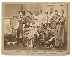 Artists in costume at the Sherwood Studio Building in New York, 1889. Watrous is seated at center.