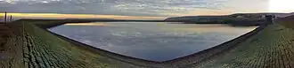 A wide angle image of a reservoir at low water