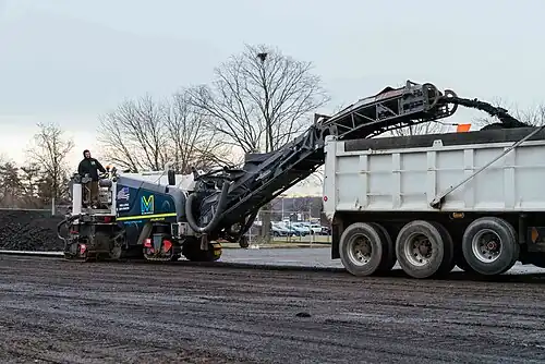 Asphalt being milled for repaving, keeping existing base.