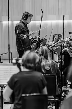 Atli Örvarsson conducting in a recording session in 2024