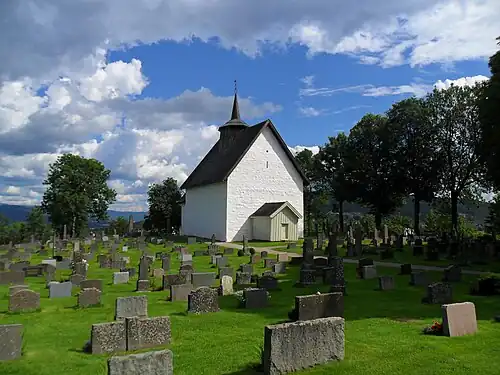 View of the Old Bø Church on the other side of the cemetery