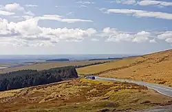 brown moorland and forestry with distant views