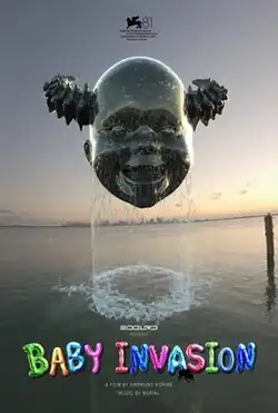 A floating baby head with demon horns above the ocean