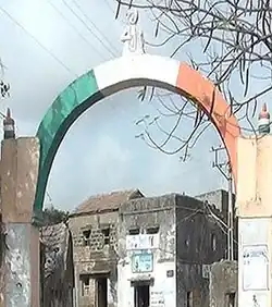 Bakharla Monument: an Indian tricolour painted arch at an entrance to the gham