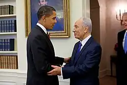 Photo of Obama shaking hands with Israeli President Shimon Peres, with Biden overlooking