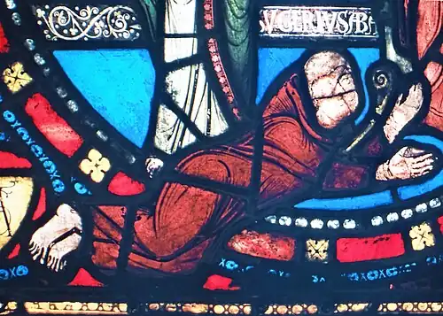 Detail of The Annunciation pane in the "Childhood of Christ" window, Suger prostrated at the feet of the Virgin Mary (12th c.)