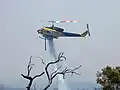 Bell 412EP Helitaks water bomber during Mount Solus group bushfire, Perth Hills, November 2015.