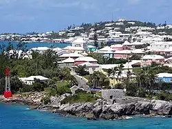 Residential suburb near the old St.&nbsp;George's Garrison, with "Town Cut Battery" or "Gate's Fort" on the shore of the Town Cut, and St.&nbsp;George's Town and its harbour in the background