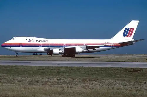 A Boeing 747-100 at Charles de Gaulle wearing Saul Bass-designed "Tulip" livery (1974–1993)