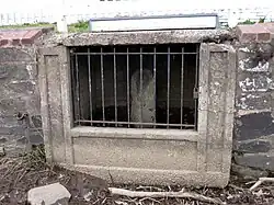 The boundary cornerstone is located in the lighthouse's sea wall.