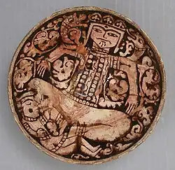 12th–13th century bowl depicting King Zahhak with snakes protruding from his shoulders, likely from Northwestern Iran. Modified c. 1926, as many medieval pieces were to make them more attractive.[6]