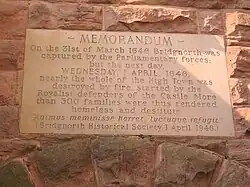 Inscription on Bridgnorth Museum, commemorating Sir Thomas Wolryche's deliberate destruction of the town in his defence of the castle against Parliamentary forces in 1646.