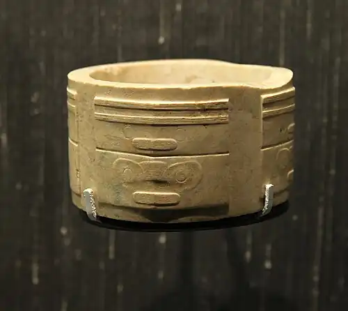 Highly stylized mascarons on a cong, produced by the Liangzhu culture, c.2500 BC, jade, British Museum, London