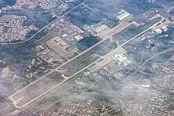 Royal Brunei Air Force Base, Rimba (top left) shares its 3,685 metres (12,090 ft) runway with the Brunei International Airport (bottom right), 2016.