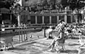 Bathers on the terrace of the hotel's outdoor wave pool, 1939